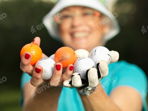 Preview: Mature lady with golf balls