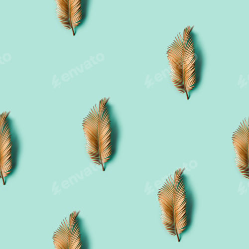 Preview: Seamless creative texture. Golden painted tropical leaf on pastel background