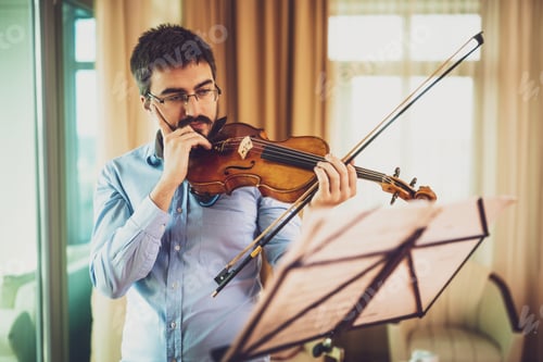 Preview: Man practicing on violin