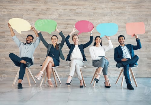 Preview: Full length shot of a diverse group of businesspeople sitting in a row together and holding posters