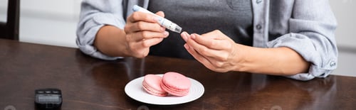 Preview: panoramic shot of woman making test while holding blood lancet