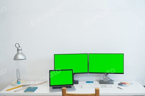 Preview: Green screen monitor stands on the office desk - Personal compute mock-up.