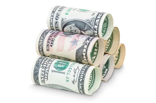 Preview: Stack of rolled dollar banknotes