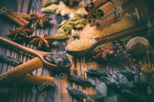 Preview: Fragrant spices for Christmas baking on wooden background