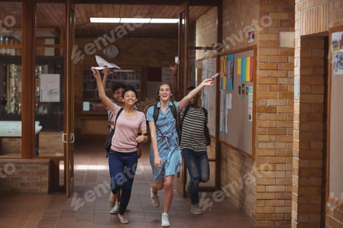 Preview: Excited classmates running with grade cards in corridor