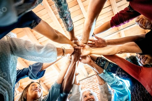 Preview: Group of people with their hands together