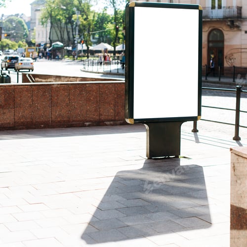 Preview: Blank vertical street billboard stand with city background.