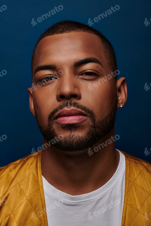 Preview: portrait of handsome african american man with diamond earring looking at camera, fashion concept