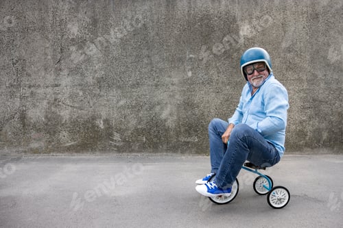 Preview: Funny businessman driving retro trike outdoor