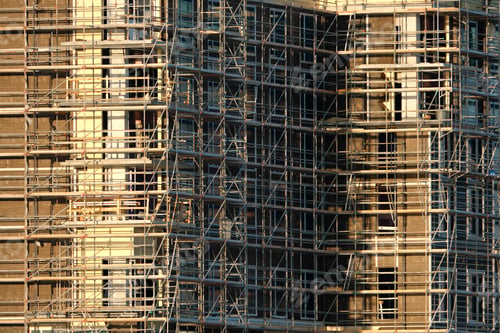 Preview: Tower lifting cranes at high residential apartment buildings construction site.