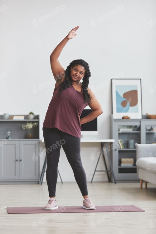 Preview: Overweight African American Woman Enjoying Home Workout