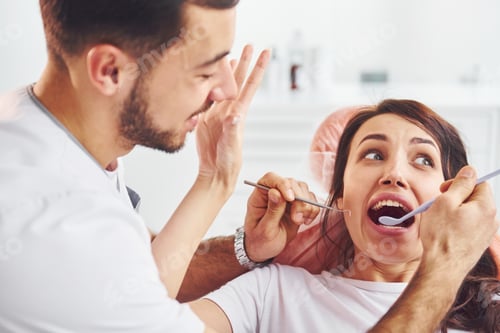Preview: Woman visiting dentist in clinic. Conception of stomatology