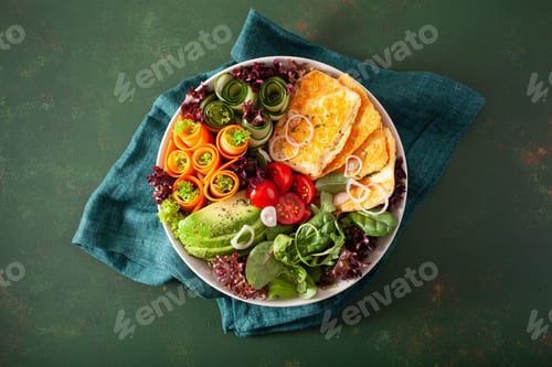 Preview: ketogenic paleo diet lunch bowl. halloumi cheese, avocado carrot cucumber salad leaves