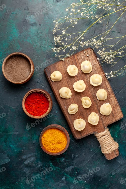Preview: top view different seasonings with raw dough on blue background dough raw food ingredient