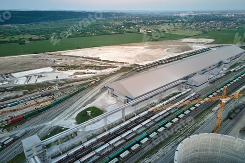 Preview: Aerial view of cargo train cars loaded with construction goods at mining factory.