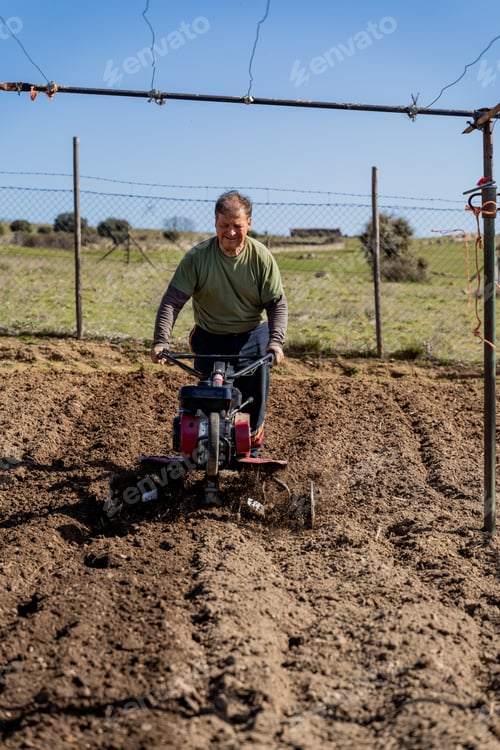 Preview: Farmer plowing field with plow