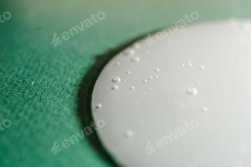 Preview: A drop of shampoo on a green background