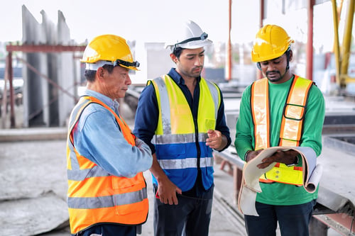 Preview: At construction site engineer check drawing correctness concrete mold before pouring concrete