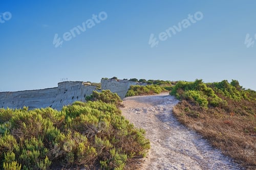 Preview: View of dirt road along cliff above sea bay near Marsaskala, Malta
