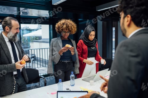 Preview: Business partners having tea break at meeting in office