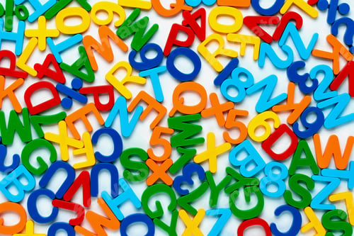 Preview: Alphabet, multicolor background with plastic numbers and letters. ABC. Education concept.