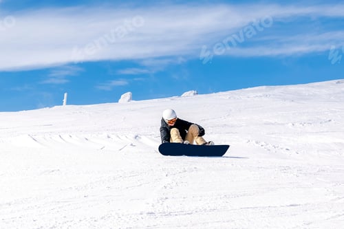 Preview: Women, girl in winter with snowboard,on snow hill at alpine ski resort,winter holiday