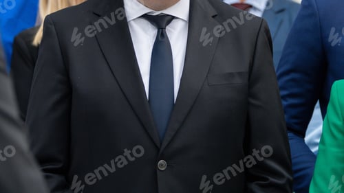 Preview: Close-up shot of a suited man at a Technology Trade Show