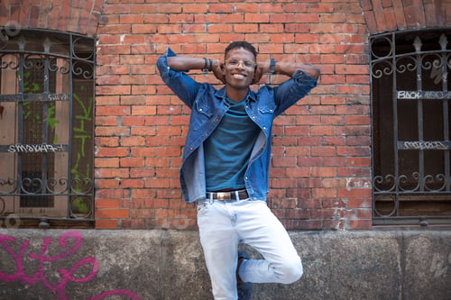 Preview: Portrait of a relaxed african man in a street
