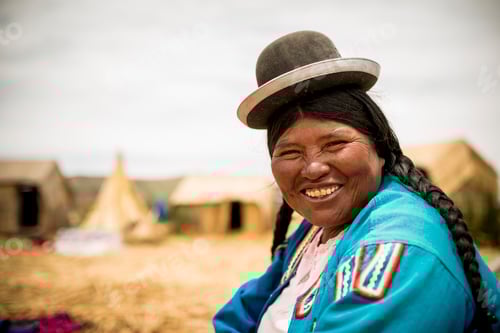 Preview: Smiling woman in traditional attire enjoying a sunny day outdoors