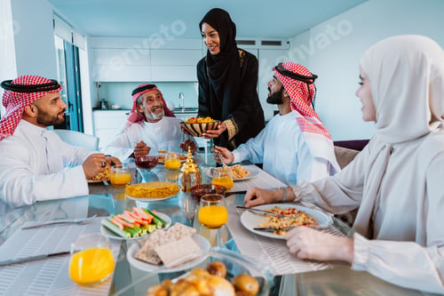 Preview: Arab family enjoying traditional meal together during ramadan