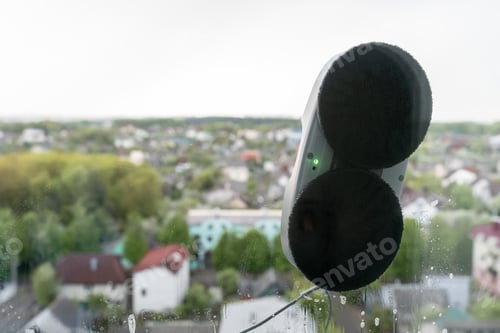 Preview: Cleaning windows with a robot in high building outdoor