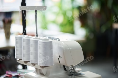 Preview: Industrial Overlock Sewing Machine Threading Multiple Spools in Workshop