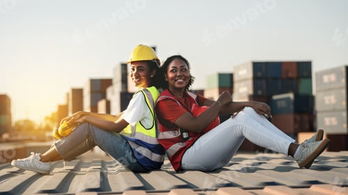 Preview: African american Woman foreman or inspector suppervisor sitting down behind each other on old cargo