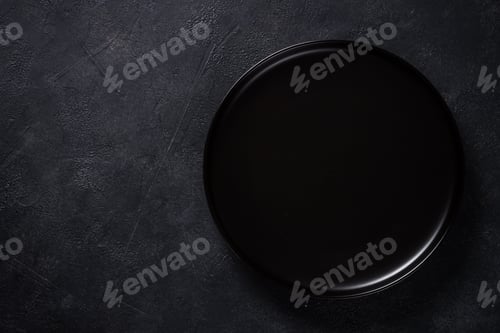 Preview: White plate, cutlery and napkin on black table top view