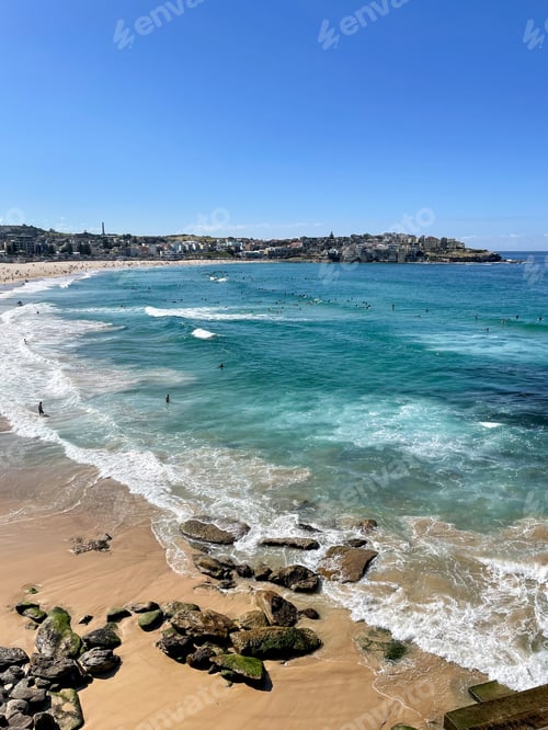 Preview: Bondi beach in the morning with surfers out surfing