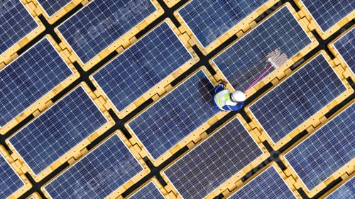 Preview: Floating solar panels providing renewable energy. Aerial view floating on solar cells