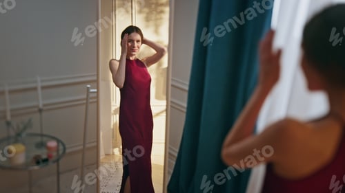 Preview: Woman try party dress planning outfit in reflection. Smiling sexy girl getting