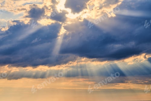 Preview: Sun rays and clouds, sunbeams shining through cumulus clouds, stunning scene of natural phenomenon