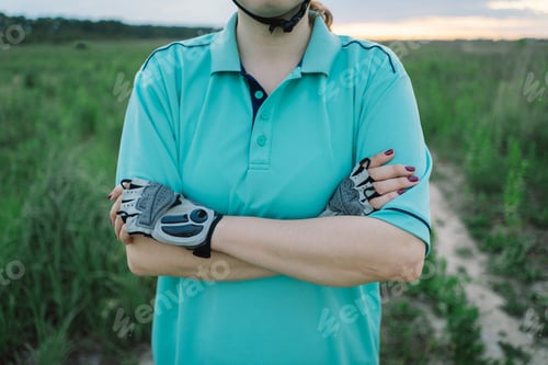 Preview: Woman Riding a Mountain Bike on a Dirt Path Near Suburbia