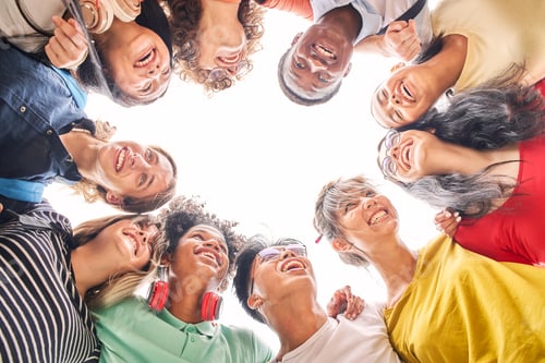 Preview: Low angle of a group of students are together, happy and smiling. Faces of young teenagers hugging.