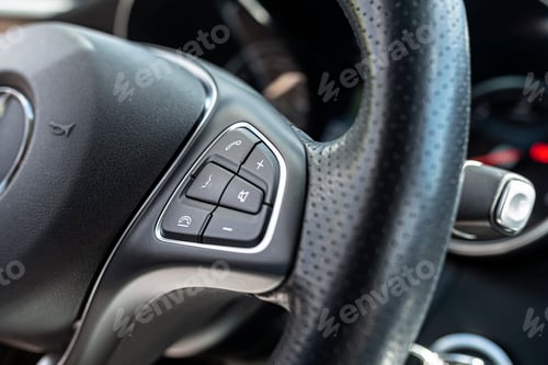 Preview: Leather multifunction steering wheel in a luxury car, visible call and volume keys on the right side