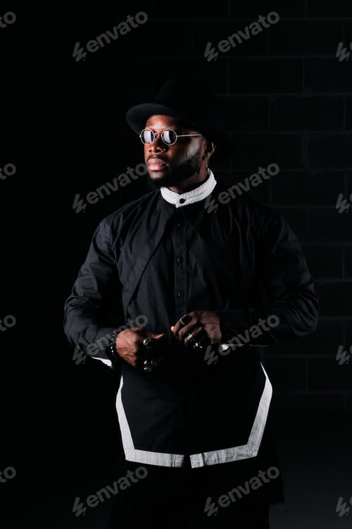Preview: African American male model in stylish black attire