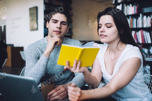 Preview: Pensive students sharing notes in notepad