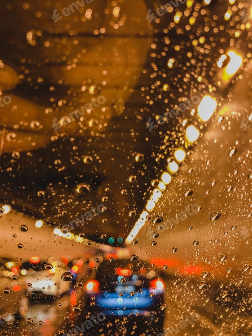 Preview: Rainy Tunnel View with Car Lights at Night