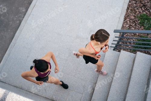Preview: Women sprinting in the morning outdoors.
