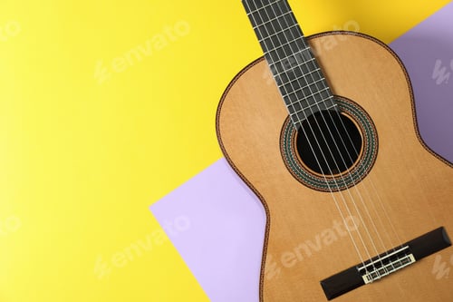 Preview: Beautiful classic guitar on two tone background, space for text