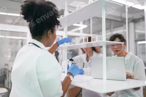 Preview: Scientist holding scientific experiment in the lab