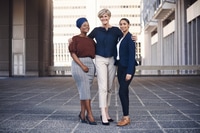 Preview: Confident Business Women Embracing in Urban Setting
