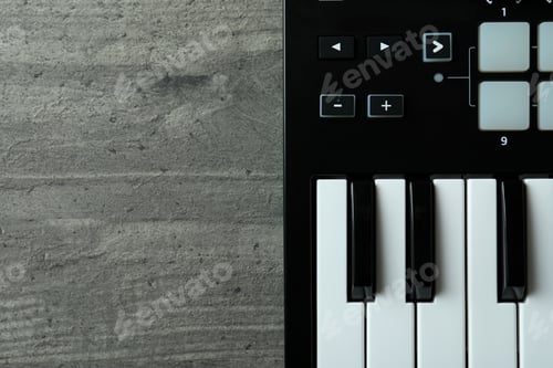 Preview: Midi keyboard on gray textured background, space for text