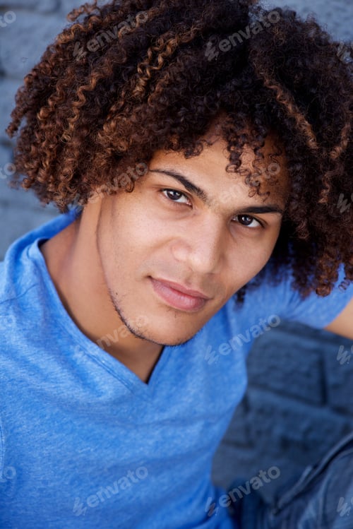 Preview: handsome young man with curly hair